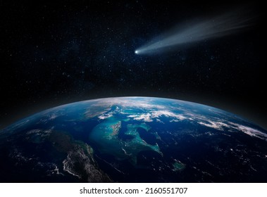 Comet, asteroid, meteorite flying to the planet Earth.  Glowing asteroid and tail of a falling comet threatening the safety of the Earth.  Elements of this image furnished by NASA.  - Shutterstock ID 2160551707