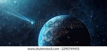 Comet, asteroid, meteorite flying to the planet Earth.  Glowing asteroid and tail of a falling comet threatening the safety of the Earth.  Elements of this image furnished by NASA. 