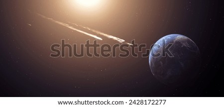 Comet, asteroid, meteorite flying to the planet Earth.  Glowing asteroid and tail of a falling comet threatening the safety of the Earth.  Elements of this image furnished by NASA. 