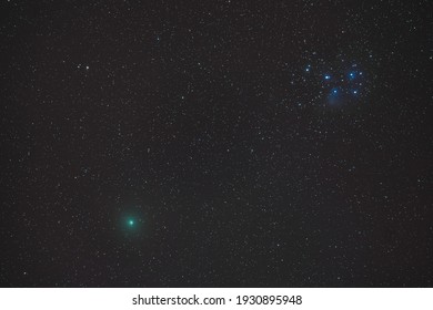 Comet Atlas At Pleiades In The Deep Sky At Night