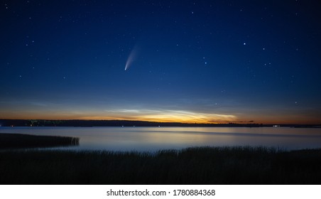 Comet C/2020 F3 (NEOWISE) over beautiful landscape at dusk