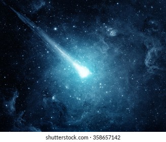 Comet in the starry sky. Elements of this image furnished by NASA. - Shutterstock ID 358657142