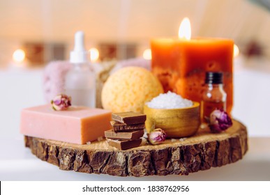 Comfort Food Concept. Small Stack Pieces Of Chocolate In Bath Room By Hot Tub. Cozy Autumn Self Pampering Time.