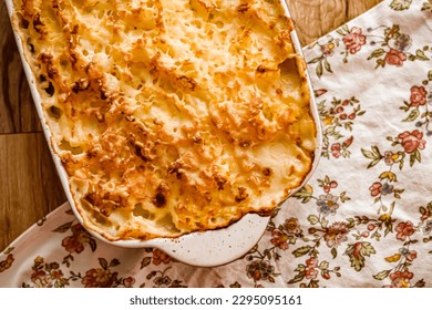 Comfort food and traditional English cuisine, oven baked fish pie on rustic wooden table in countryside kitchen, homemade recipe idea