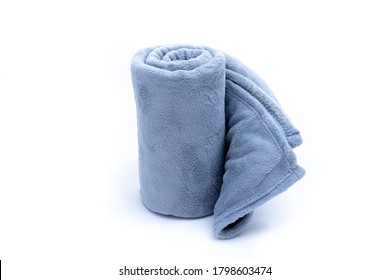 Comfort Rolled up grey coral fleece throw isolated on white background