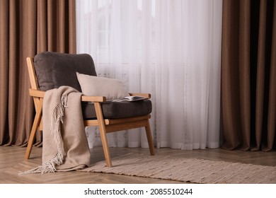 Comfortable Armchair With Blanket Near Window Indoors, Space For Text. Interior Design