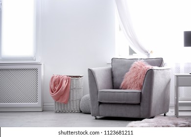 Comfortable Armchair With Fuzzy Pillow In Stylish Room Interior