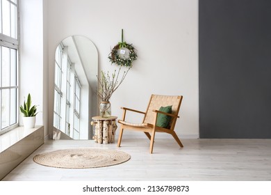 Comfortable armchair  mirror   Easter decor in light room interior