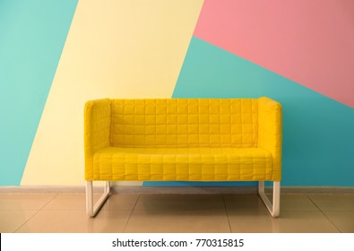 Comfortable Armchair Near Color Wall