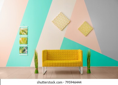 Comfortable Armchair Near Color Wall