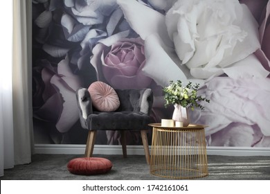 Comfortable Armchair Near Wall With Floral Print. Stylish Room Interior