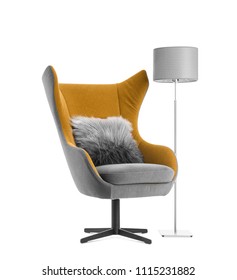 Comfortable armchair with pillow and lamp on white background. Interior element