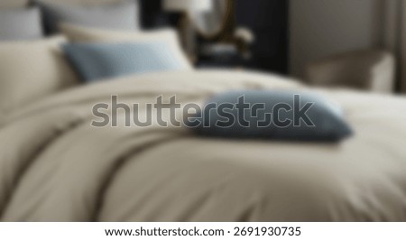 Comfortable bedding ensemble featuring neutral tones and contrasting accent cushions creates a restful bedroom scene