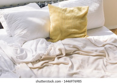 Comfortable Bedroom Unmade White Linen And Pillow After Sleep With Sun Light In The Morning.