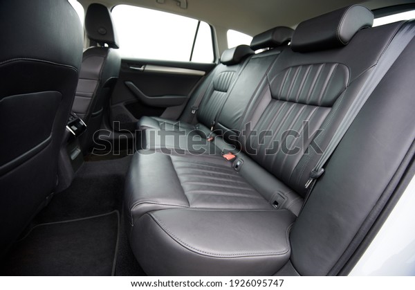 Comfortable black\
leather car soft clean rear seat\
