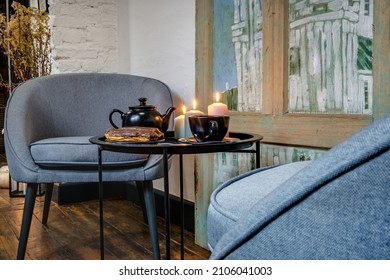 comfortable chairs and table with flowers  in interior the modern living room 