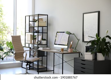 Comfortable Office Chair Near Desk With Modern Computer Indoors