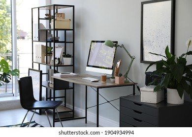 Comfortable Office Chair Near Desk With Modern Computer Indoors