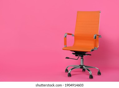 Comfortable Office Chair On Pink Background, Space For Text