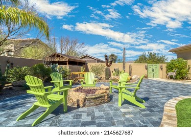 A comfortable outdoor seating area around a firepit  - Shutterstock ID 2145627687