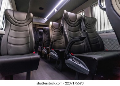 comfortable passenger bus interior with upholstered seats; individual transfer for a group of people; conversion of the interior of a truck;  - Powered by Shutterstock