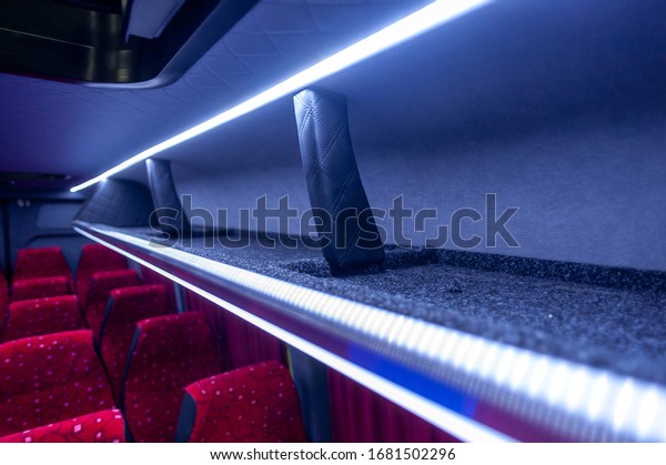 comfortable\
passenger bus interior with upholstered\
seats