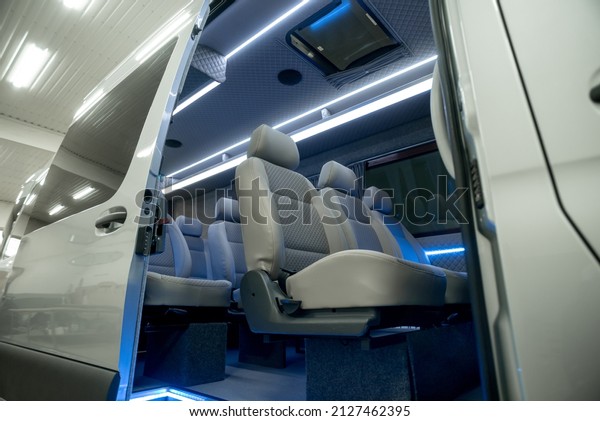 comfortable passenger bus interior with\
upholstered seats\
