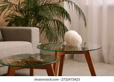 Comfortable sofa with coffee table in interior of living room