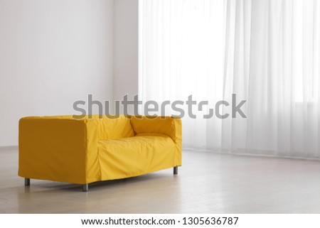 Comfortable sofa in empty room