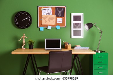 Comfortable Work Space Near Green Wall