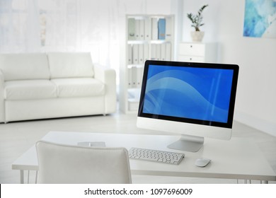 Comfortable workplace with computer on desk in home office