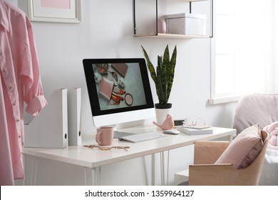 Comfortable workplace with computer on desk in home office