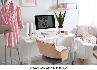 Comfortable workplace with computer on desk in home office