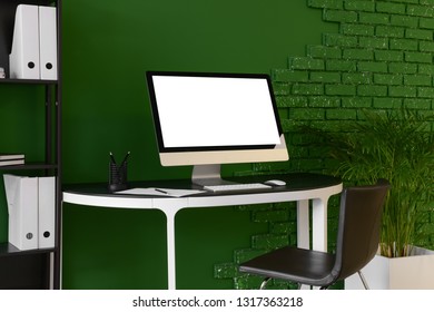 Comfortable workplace with modern computer in room