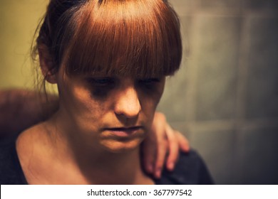 Comforting Hand On A Shoulder Of Crying Abused Woman