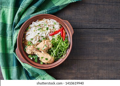 Comforting Homemade Instant Pot Vietnamese Pho With Chicken, Chili, Onions, Mung Bean Sprouts, Lime, Dressed With Fish Sauce And Spices Served On A Wooden Table, Copy Space, View From Above