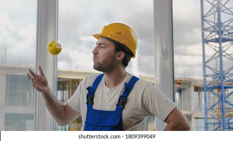 Comic fail. Builder drops the apple and pics it up.
