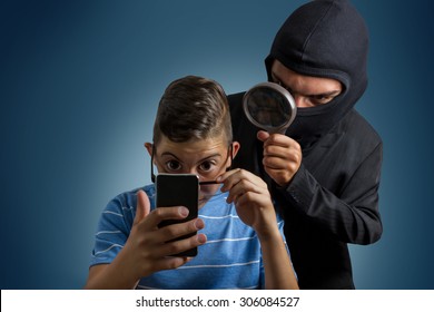 Comic Masked Man Spying Data From Smartphone Of Teenager