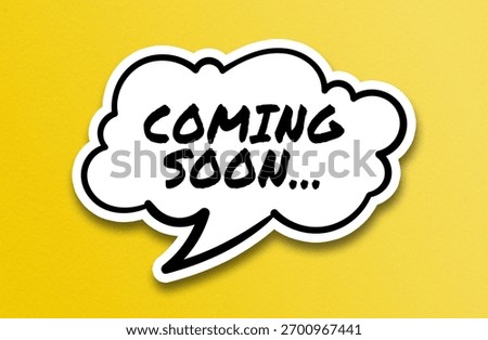 Comic speech bubble with “Coming Soon” text on yellow background
