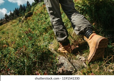I am coming. Close up of female legs in stylish boots on the road with grass. Young lady heading to the forest - Shutterstock ID 1191541330