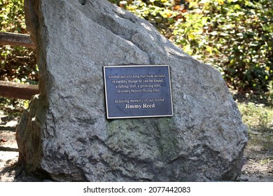 Commack, NY, USA, 9.18.21 - A large boulder at Hoyt Farm with a plaque that is dedicated "in loving memory of our friend Jimmy Reed". 