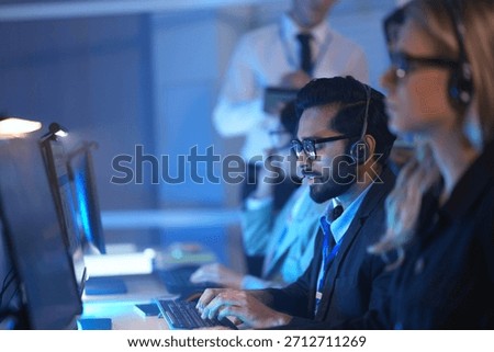 Command center lead focused intense monitoring critical systems late night headset connects team analyzing real time data screen crucial vigilance protects infrastructure operation underway now execut