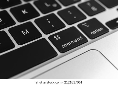 Command key and button on apple keyboard. Command sign close-up. Modern laptop, communication concept