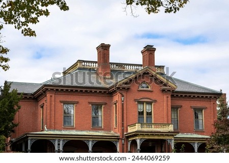 Commander's Mansion, historic red brick property in Watertown Arsenal, on an autumn cloudy day, MA, USA