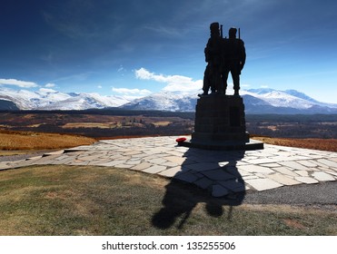The Commando memorial monument in silhouette with the snow covered Ben Nevis mountain range in the distance. Located 1 mile north of the village Spean bridge near Fort William, Scotland.