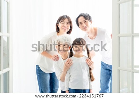 Commemorative photo of a three-generation family. Photo studio.