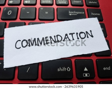 Commendation writting on table background.