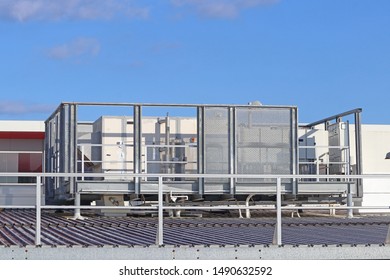 Commercial air-conditioning unit on a factory roof - Shutterstock ID 1490632592