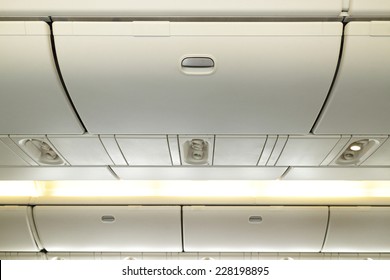 Commercial Aircraft Interior In Airplane Cabin, Overhead Compartment