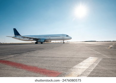 Commercial airplane during taxiing on taxiway to airport runway for take off on sunny day.
 - Powered by Shutterstock